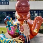 Down the street from our rental are large cat sculptures. They are now some of Aster's best friends.