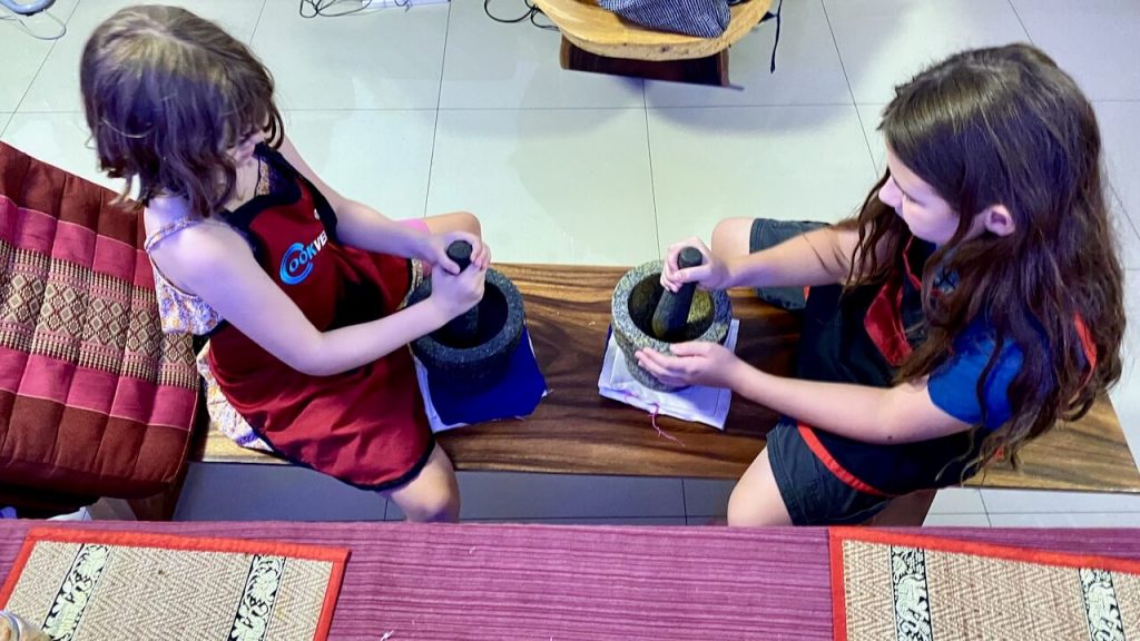 Aster and Connor use mortars and pestles to make Thai curry paste from scratch