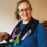 Jodie's travel scarf with hidden pocket is great on travel days and when relaxing with a coffee in our room