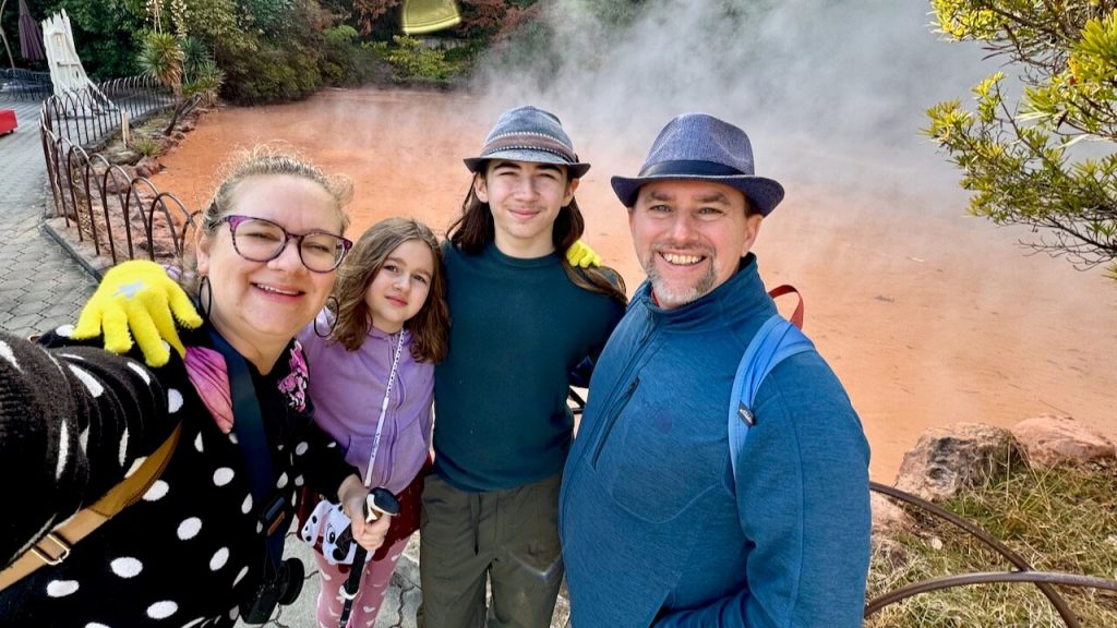Two adults and two kids at the Blood Pond Hell of Beppu