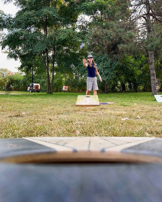Boy plays cornhole at the Muskegon Irish Music Festival in Michigan