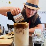 Family makes Vietnamese coffees at a class in Da Nang