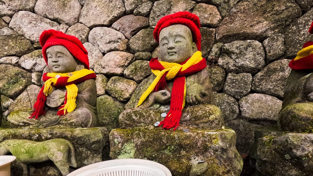 During winter in Japan, don't be surprised if temple statues are wearing hats and scarves