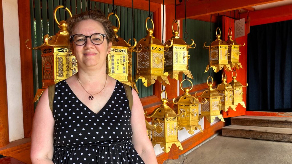 Woman visits a lantern area at Kasuga Taisha in Nara, Japan