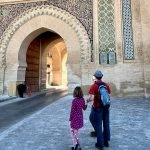 Daughter and dad stand before one of the medina gates in Meknes, Morocco. Our family of four has used eSIMs all over the world, from Malaysia to Morocco and beyond.